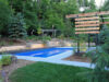 60425cc90518b7dd94bb1f0e Modern pool with custom retaining wall